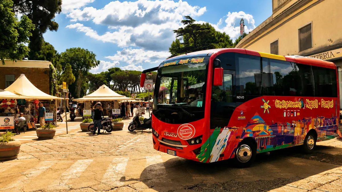 Sightseeing coach waiting at Largo Castello in Naples before the round-trip shuttle to Pompeii, Campania, Italy