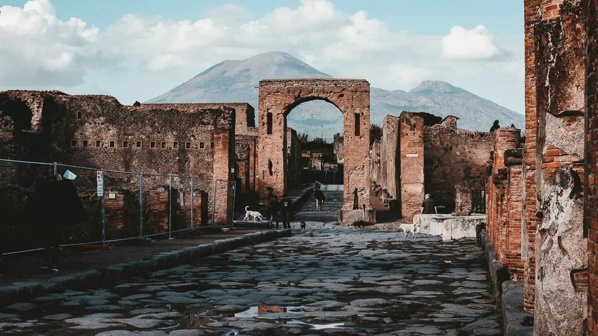 Mosaic floor and frescoed wall in a Herculaneum house on a Pompeii and Herculaneum tour from Naples with lunch, Italy